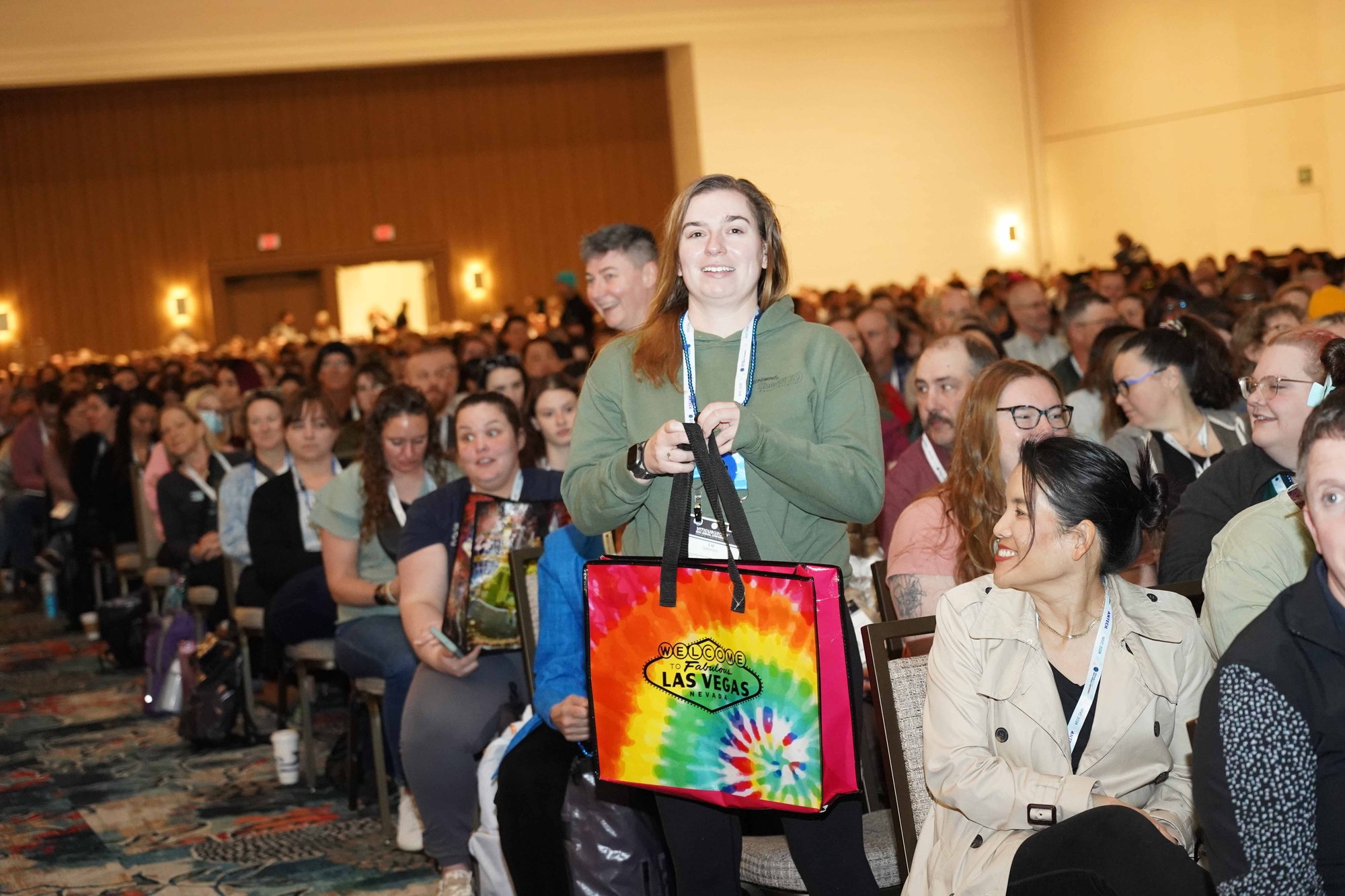 woman winning prize at gen session